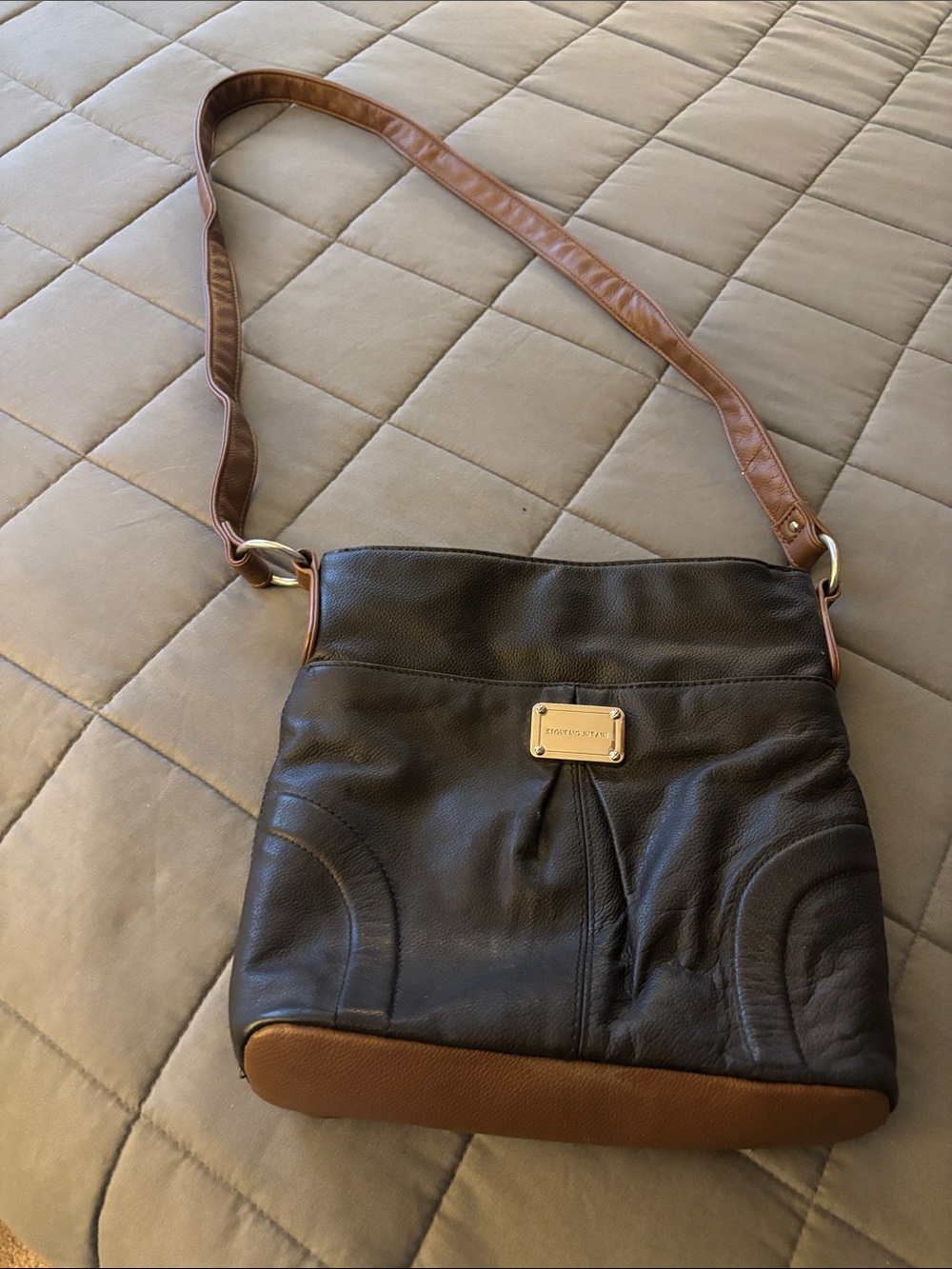 Stone Mountain Black and Brown PU Leather Crossbody with outside pocket.